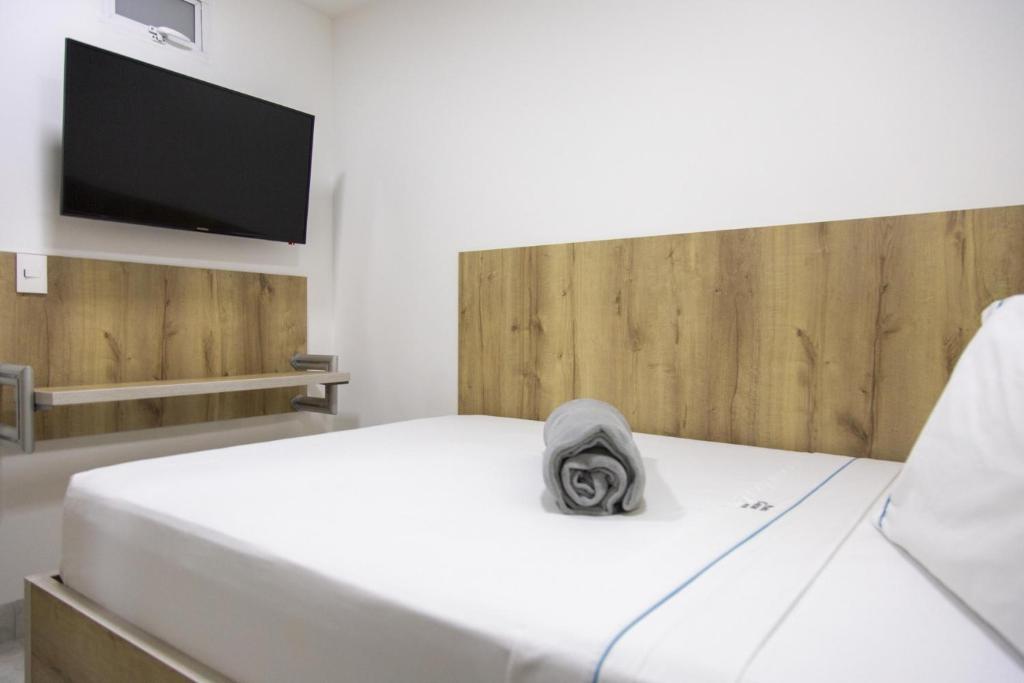 Postel nebo postele na pokoji v ubytování Hotel Park Caribe