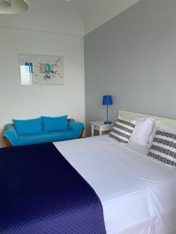 Postel nebo postele na pokoji v ubytování Capri Inn