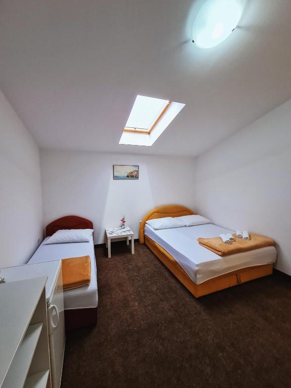 Postel nebo postele na pokoji v ubytování Guest house Davorka