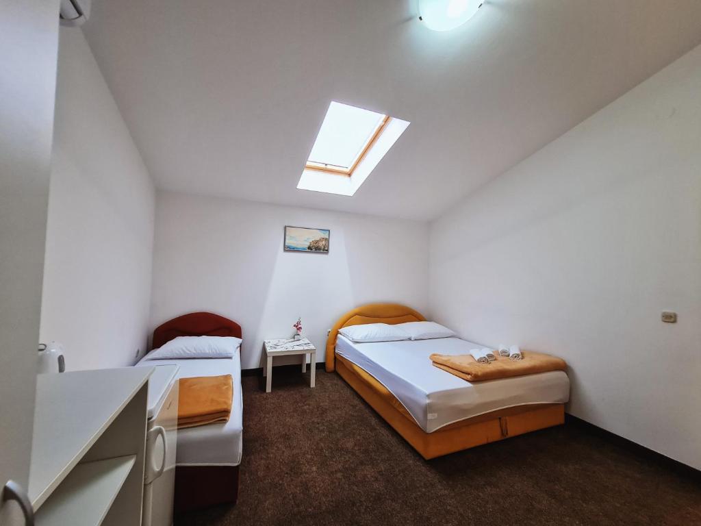 Postel nebo postele na pokoji v ubytování Guest house Davorka
