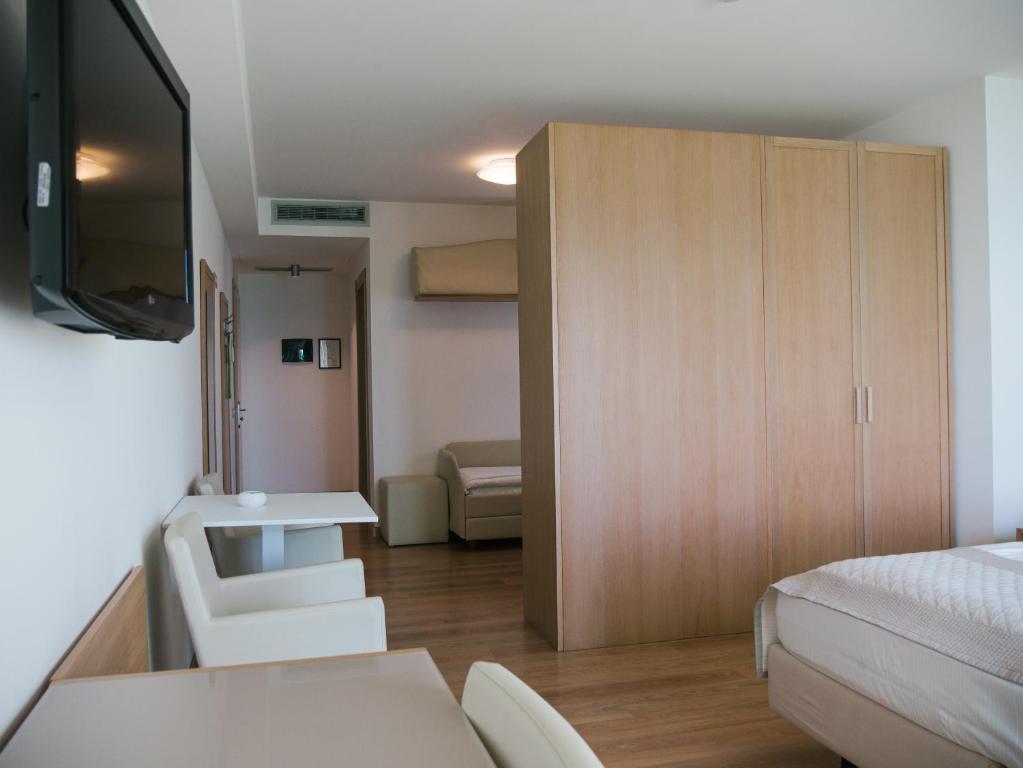 Postel nebo postele na pokoji v ubytování Hotel Bristol
