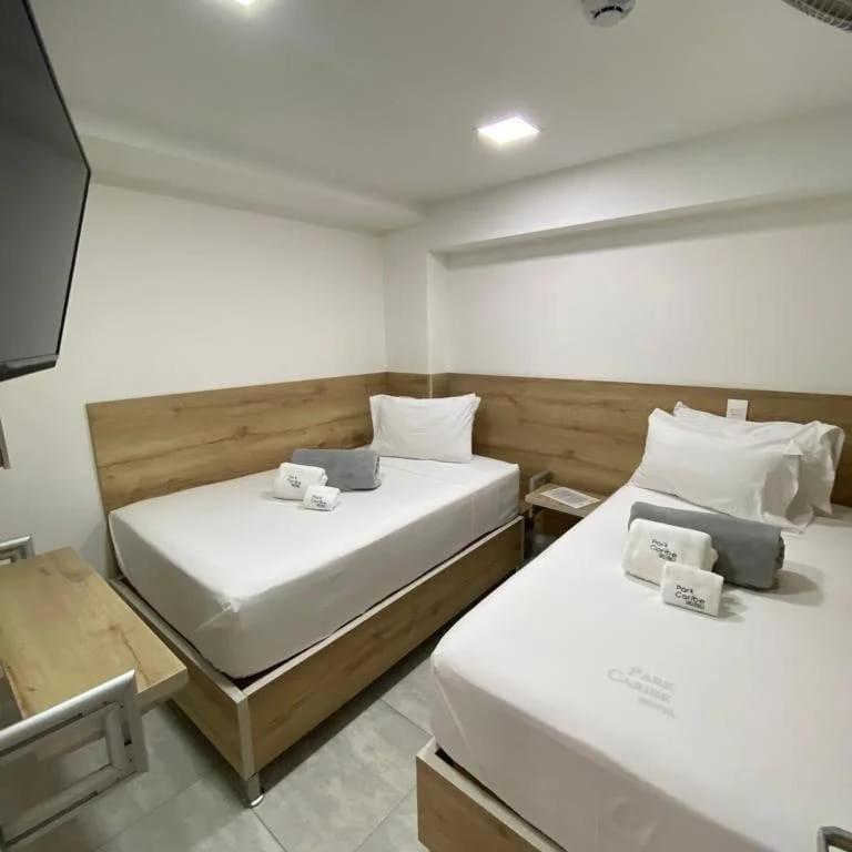 Postel nebo postele na pokoji v ubytování Hotel Park Caribe