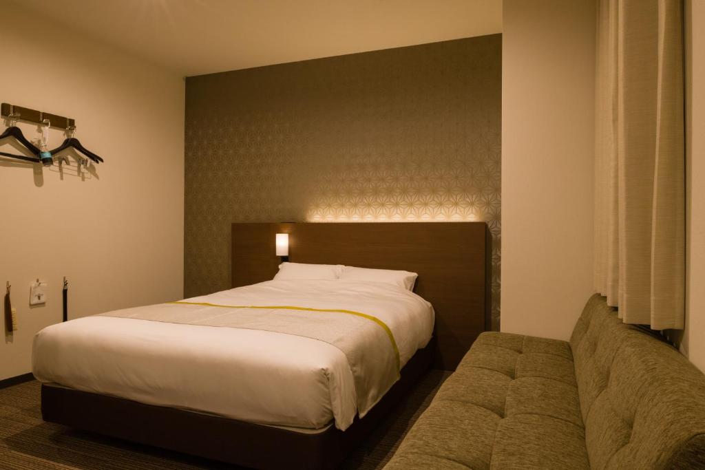 Tosei Hotel Cocone Ueno房間的床