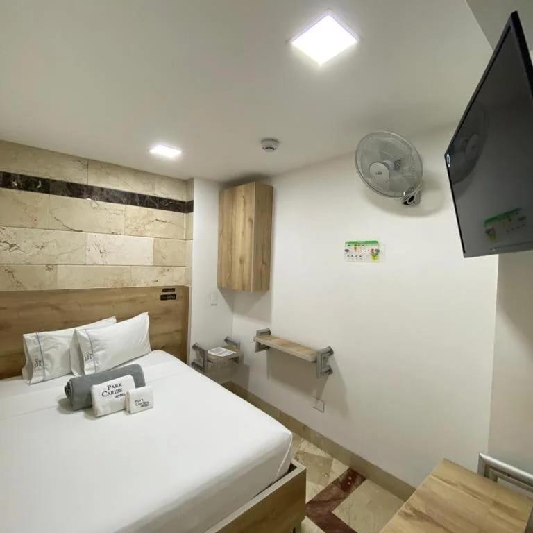 Postel nebo postele na pokoji v ubytování Hotel Park Caribe
