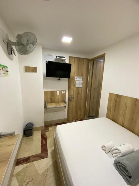 Postel nebo postele na pokoji v ubytování Hotel Park Caribe