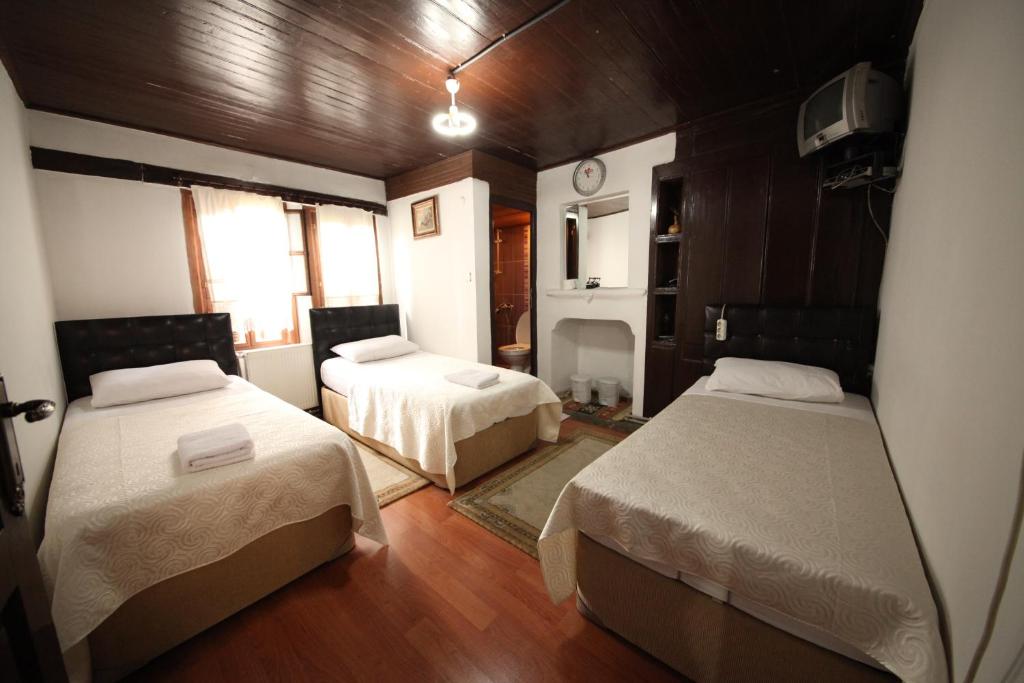 Postel nebo postele na pokoji v ubytování Efe Guest House