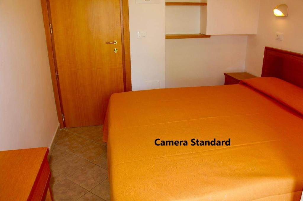 Postel nebo postele na pokoji v ubytování Hotel Alessi** Rimini