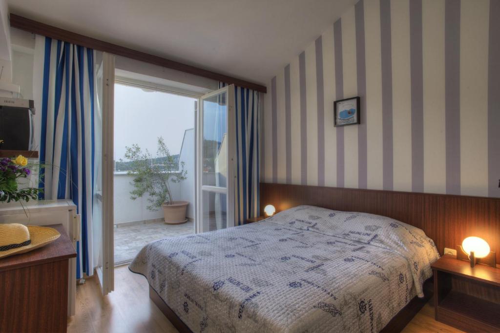 Postel nebo postele na pokoji v ubytování Gina Bed & Breakfast
