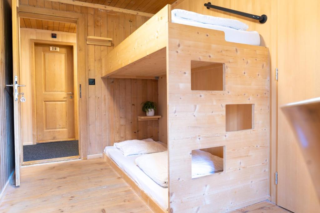 Postel nebo postele na pokoji v ubytování Naturfreunde Hostel Grindelwald