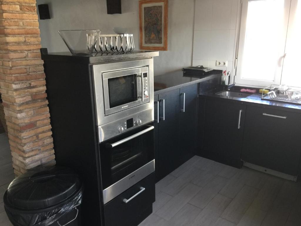 Kuchyňa alebo kuchynka v ubytovaní chalet al-alba