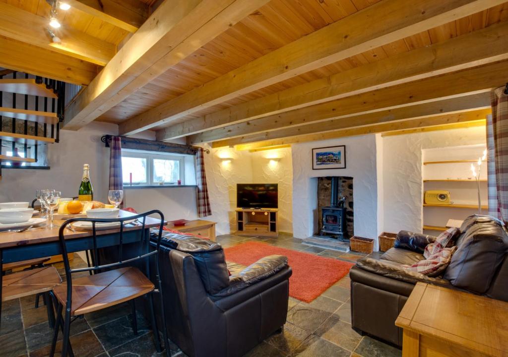 a living room with couches and a table and a dining room at Shicley in Trevine