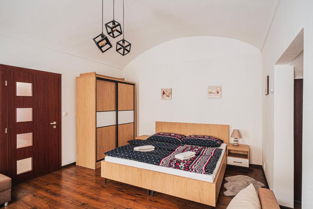 Posteľ alebo postele v izbe v ubytovaní Apartman PIATAK