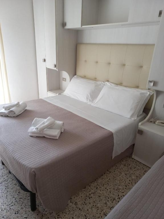 Postel nebo postele na pokoji v ubytování Hotel Helvetia