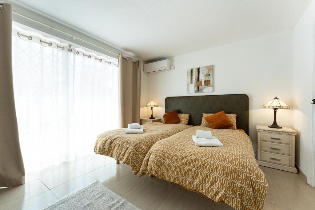 A bed or beds in a room at 4 bedroom beach Villa with direct access to the beach and private pool between Fuengirola and Marbella - Mijas costa