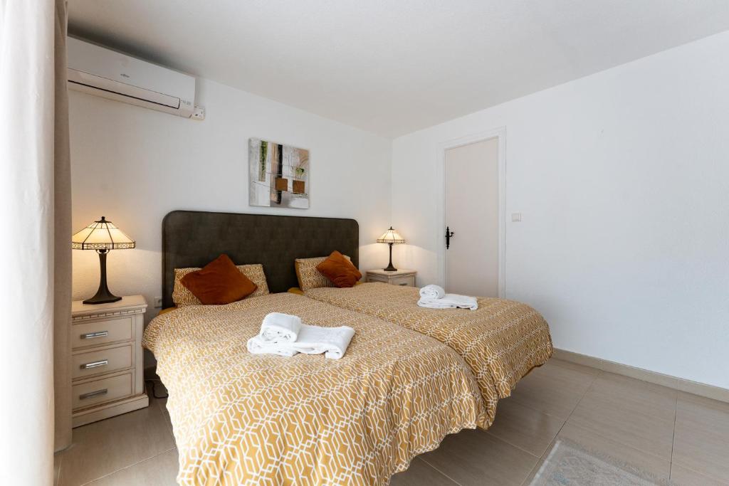 A bed or beds in a room at 4 bedroom beach Villa with direct access to the beach and private pool between Fuengirola and Marbella - Mijas costa