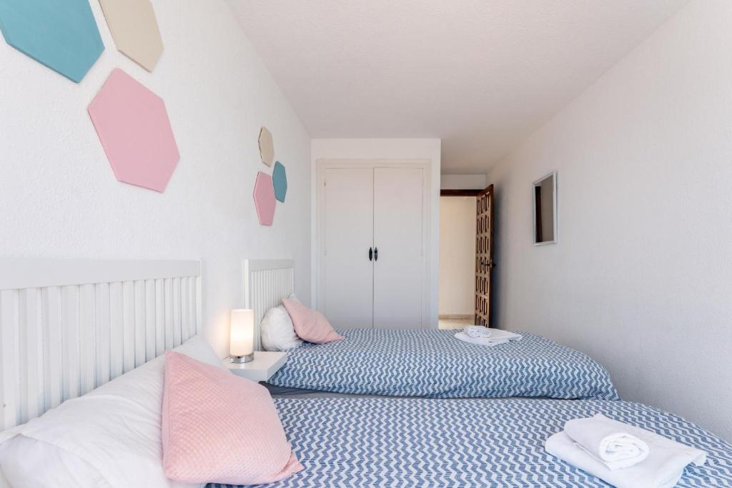 A bed or beds in a room at 4 bedroom beach Villa with direct access to the beach and private pool between Fuengirola and Marbella - Mijas costa