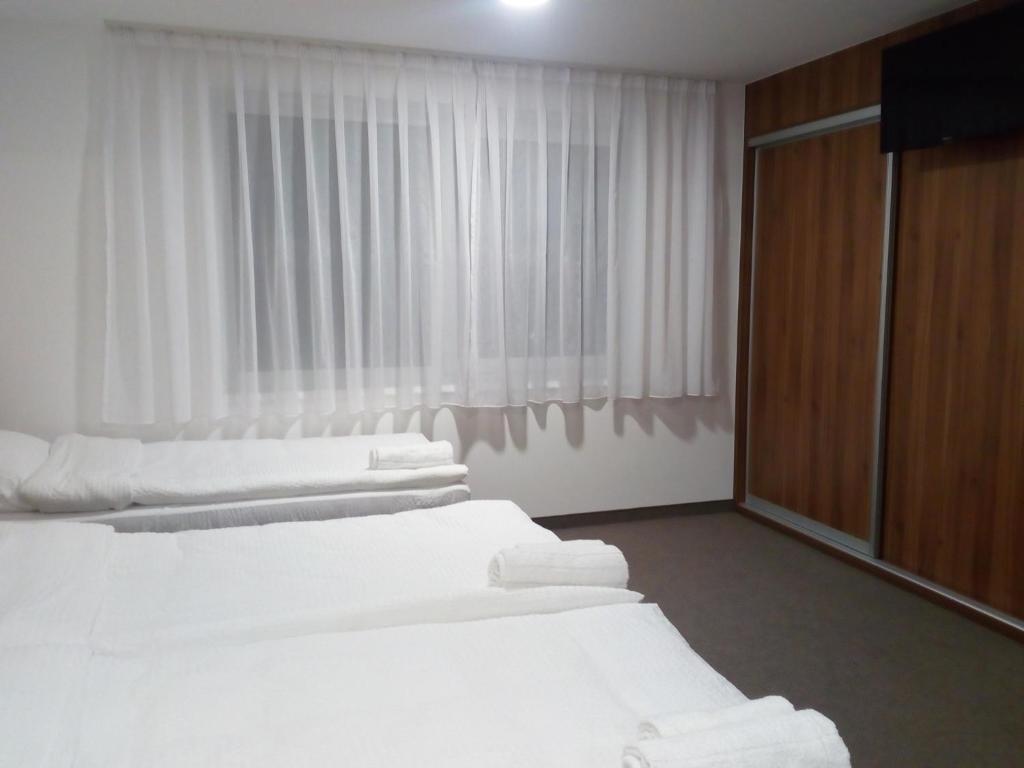 Postel nebo postele na pokoji v ubytování Malena