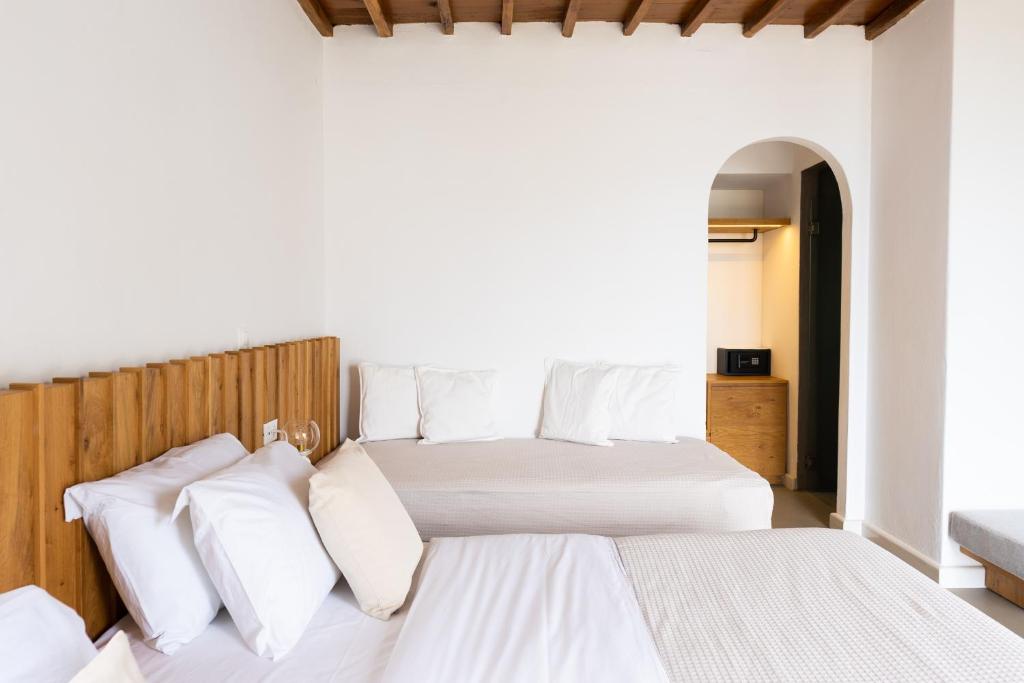 Łóżko lub łóżka w pokoju w obiekcie Rhenia Hotel