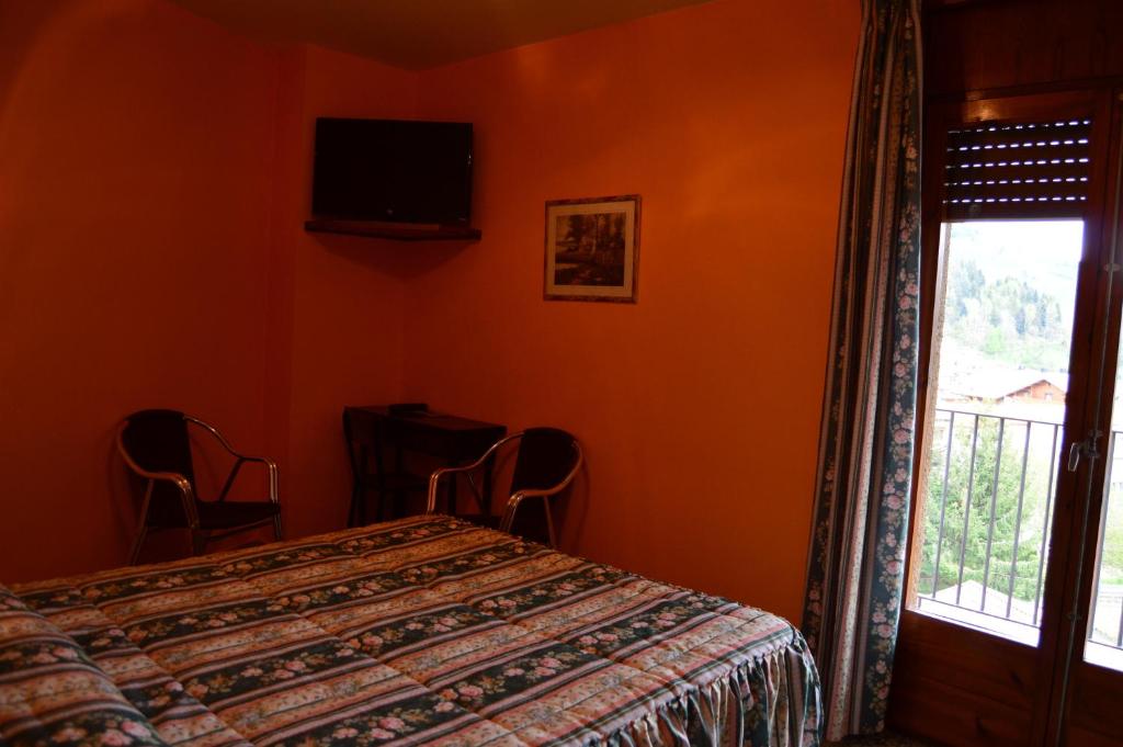 Postel nebo postele na pokoji v ubytování Hostal l'Escon