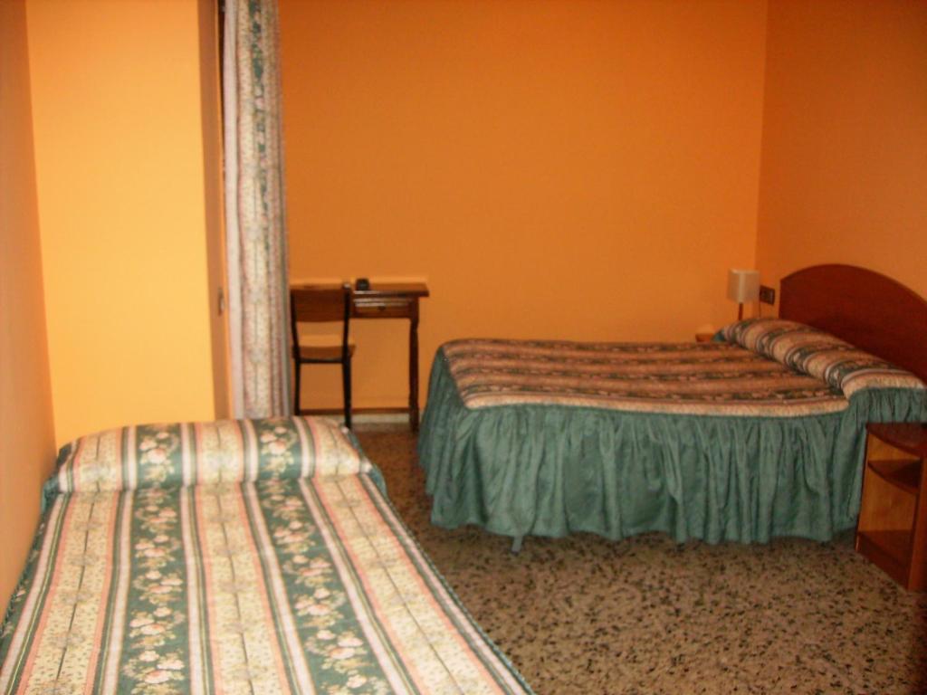 Postel nebo postele na pokoji v ubytování Hostal l'Escon