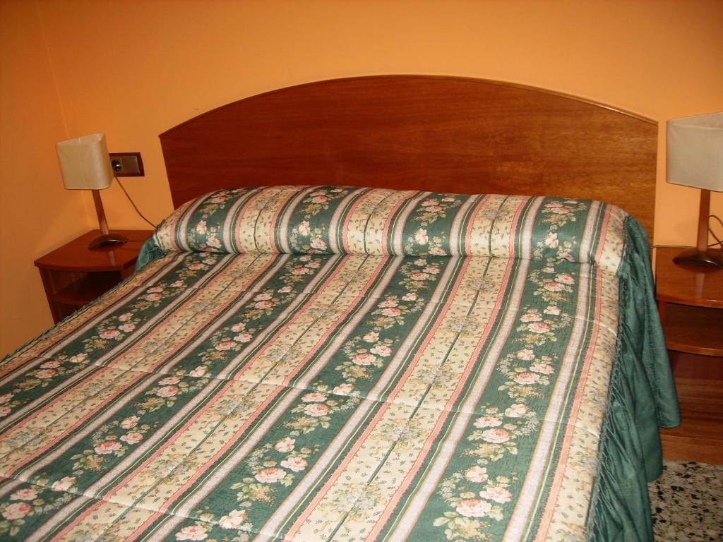 Postel nebo postele na pokoji v ubytování Hostal l'Escon