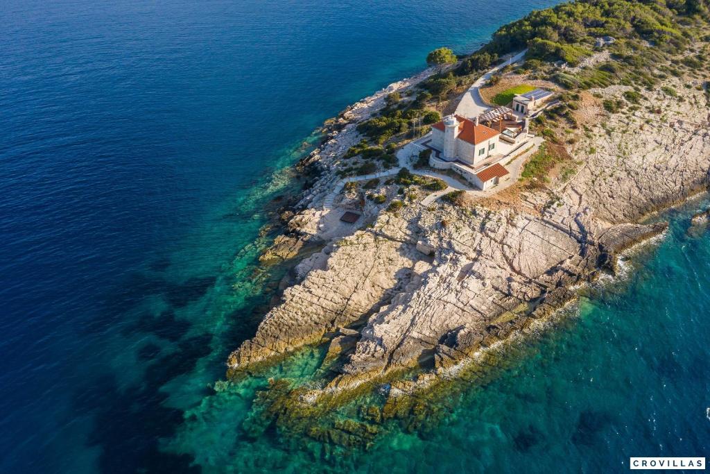 an aerial view of a house on an island in the ocean at Vis in Vis