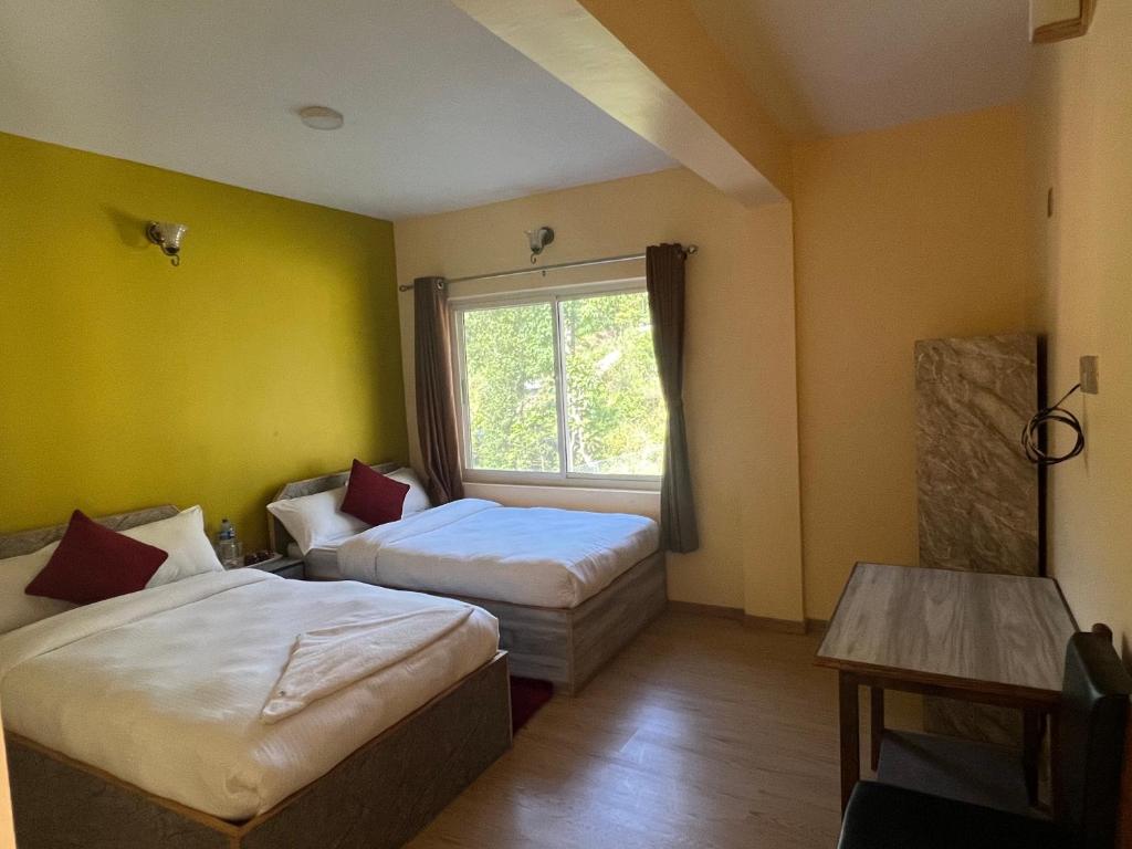 Postel nebo postele na pokoji v ubytování Hotel Village View Nagarkot