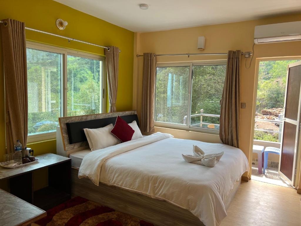 Postel nebo postele na pokoji v ubytování Hotel Village View Nagarkot