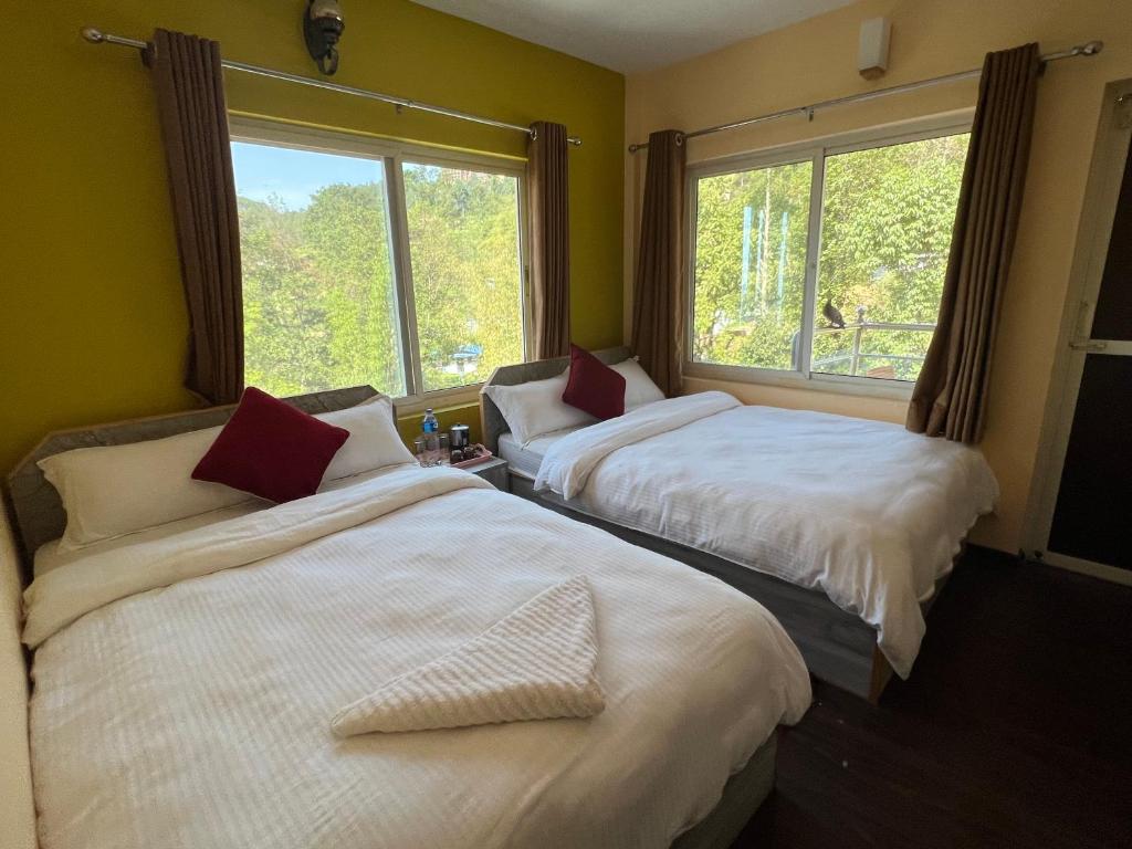 Postel nebo postele na pokoji v ubytování Hotel Village View Nagarkot