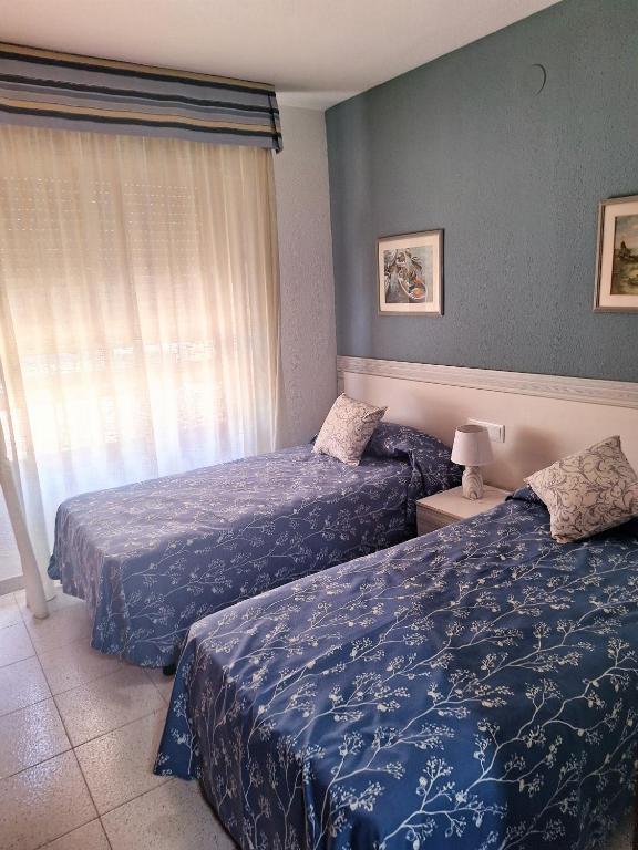 Postel nebo postele na pokoji v ubytování APARTAMENTO CENTRICO