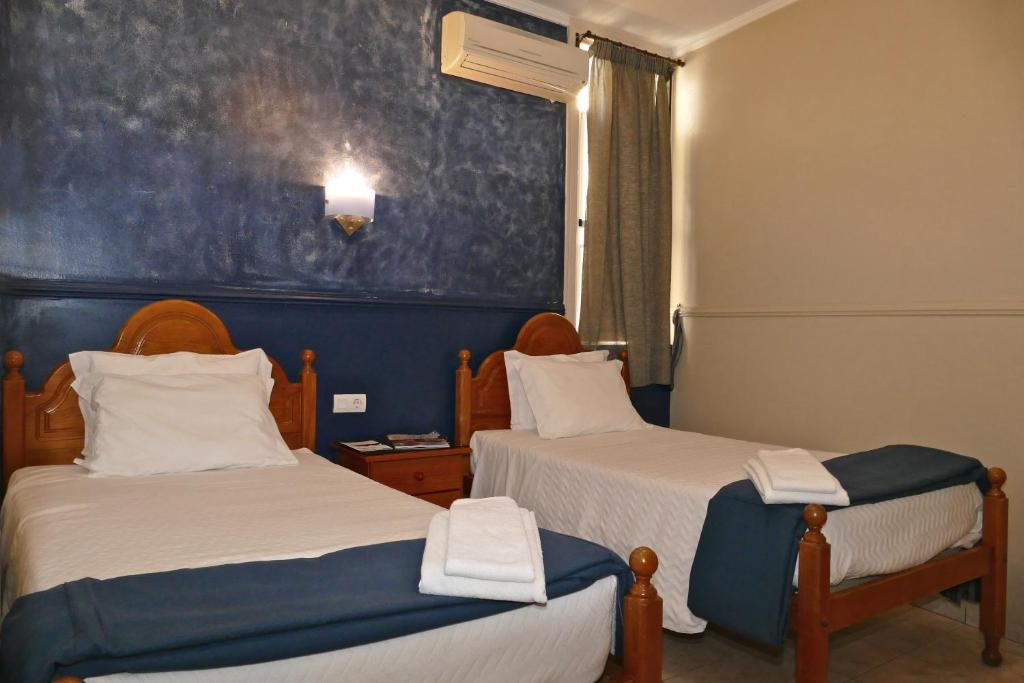 Postel nebo postele na pokoji v ubytování Guest House Sao Filipe