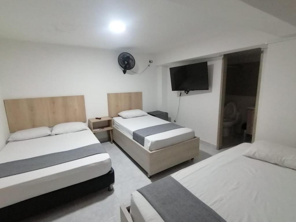 Postel nebo postele na pokoji v ubytování Hotel Urbano 70