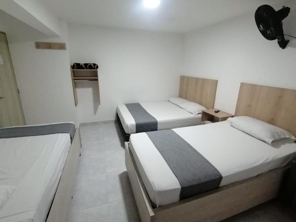 Postel nebo postele na pokoji v ubytování Hotel Urbano 70