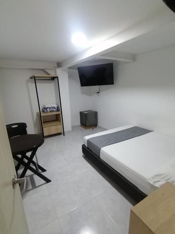 TV a/nebo společenská místnost v ubytování Hotel Urbano 70