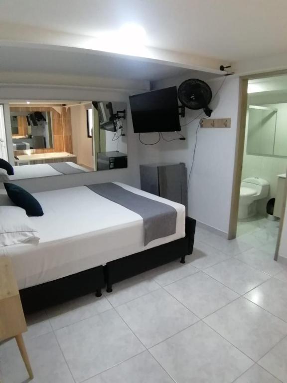 Postel nebo postele na pokoji v ubytování Hotel Urbano 70