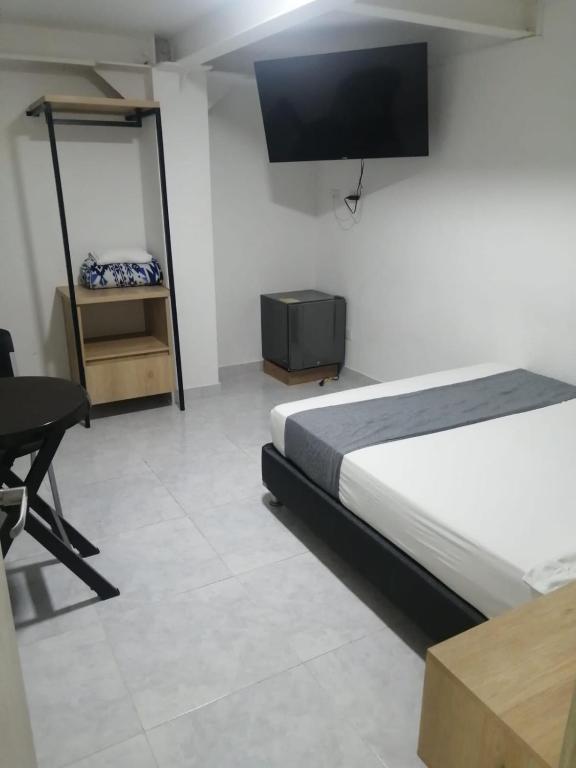 TV a/nebo společenská místnost v ubytování Hotel Urbano 70