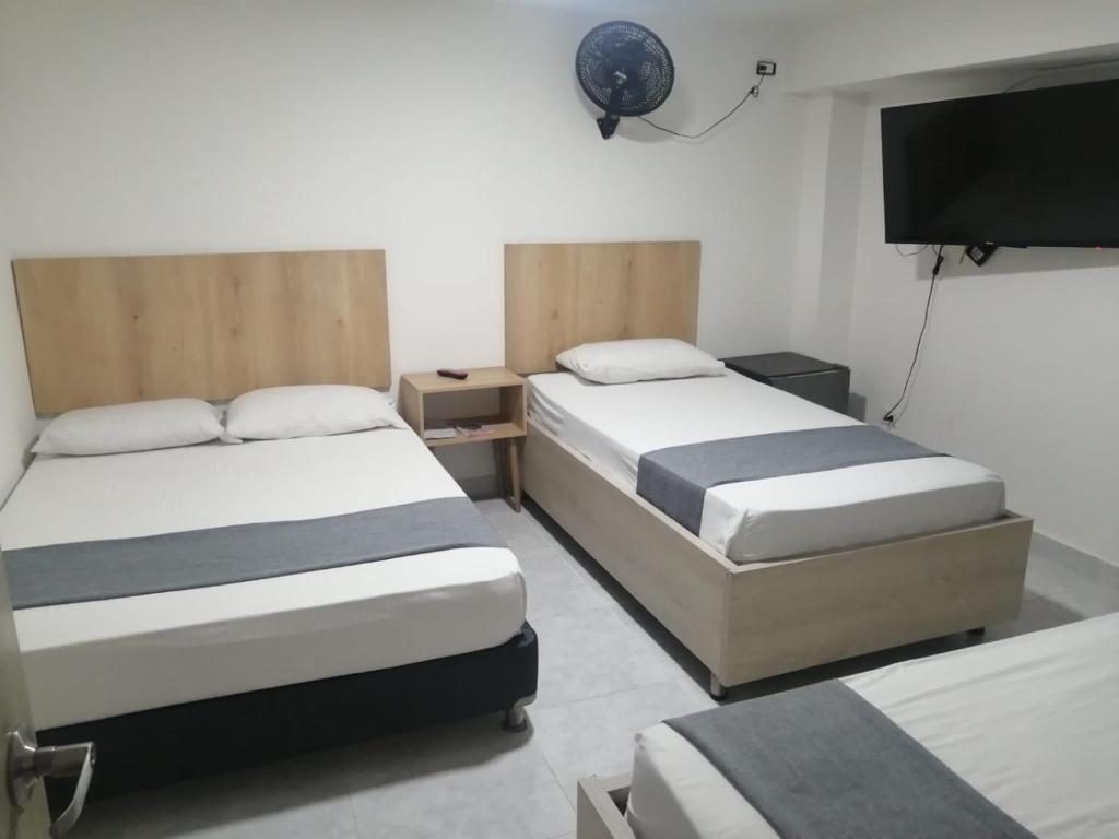 Postel nebo postele na pokoji v ubytování Hotel Urbano 70