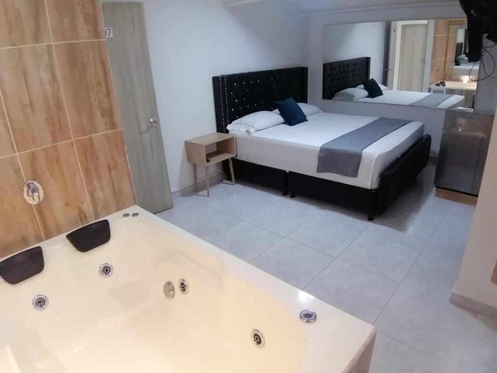 Postel nebo postele na pokoji v ubytování Hotel Urbano 70