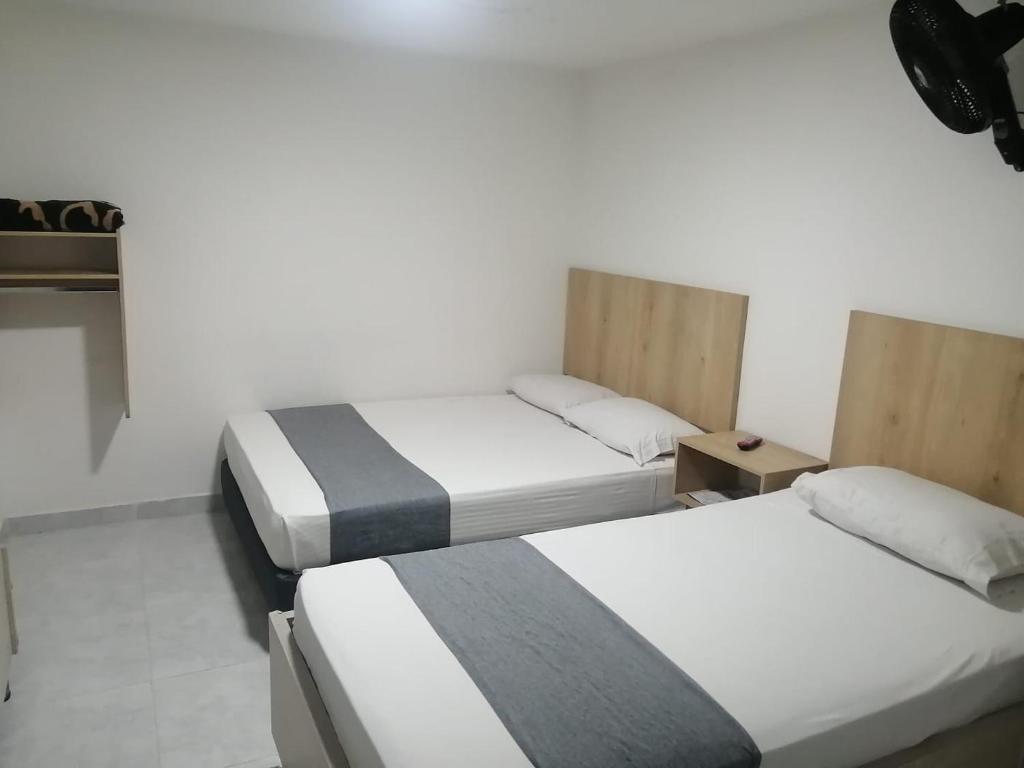 Postel nebo postele na pokoji v ubytování Hotel Urbano 70