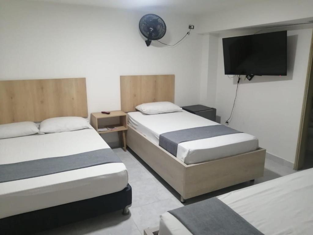 Postel nebo postele na pokoji v ubytování Hotel Urbano 70