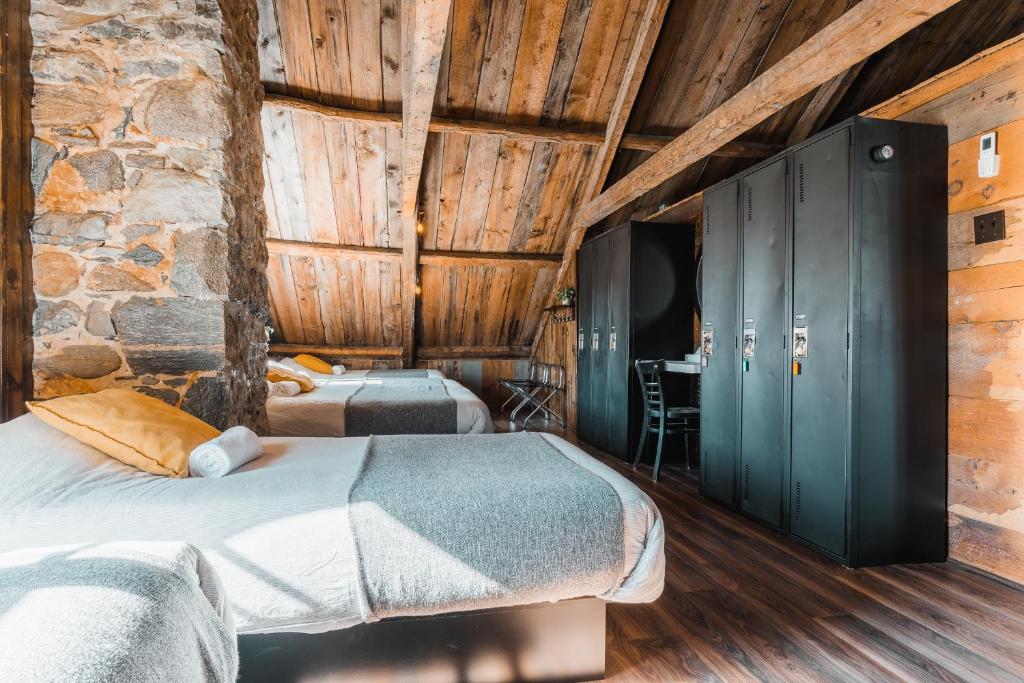Postel nebo postele na pokoji v ubytování Auberge de l'Ouest