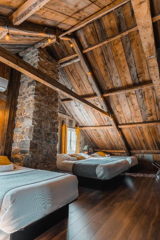Postel nebo postele na pokoji v ubytování Auberge de l'Ouest