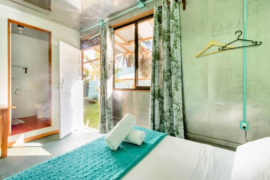 Postel nebo postele na pokoji v ubytování Container House Cahuita