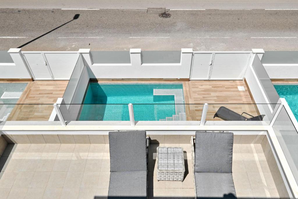a view of a swimming pool from the top of a building at Villa Luna in San Pedro del Pinatar