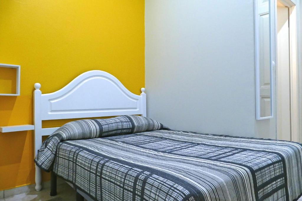 Postel nebo postele na pokoji v ubytování Guest House Sao Filipe