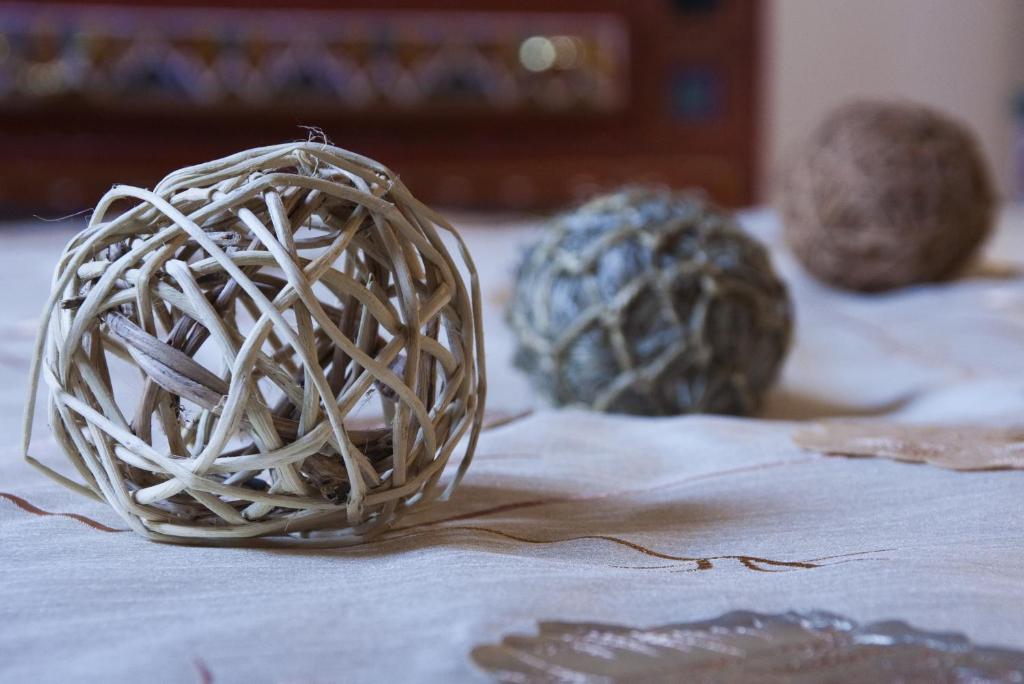 two balls of yarn sitting on top of a table at Riad Fes Kettani in Fez