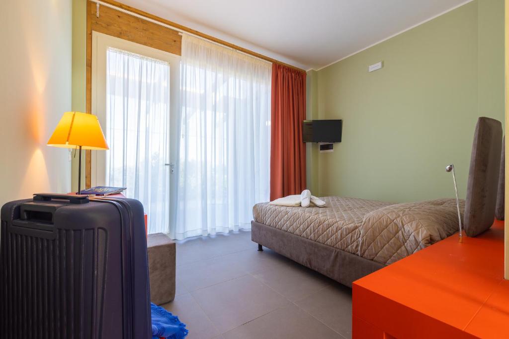 Postel nebo postele na pokoji v ubytování Fani Rooms