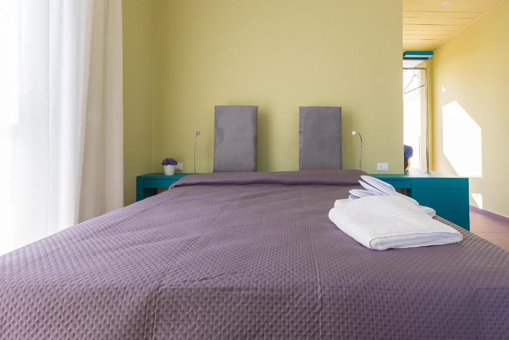 Postel nebo postele na pokoji v ubytování Fani Rooms