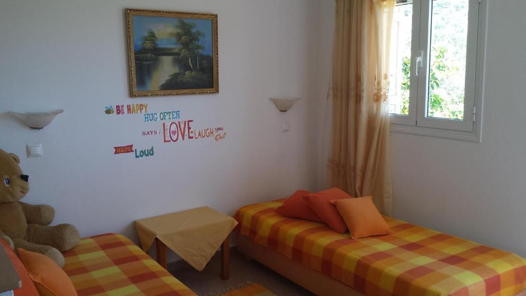 Postel nebo postele na pokoji v ubytování Galini Apartments