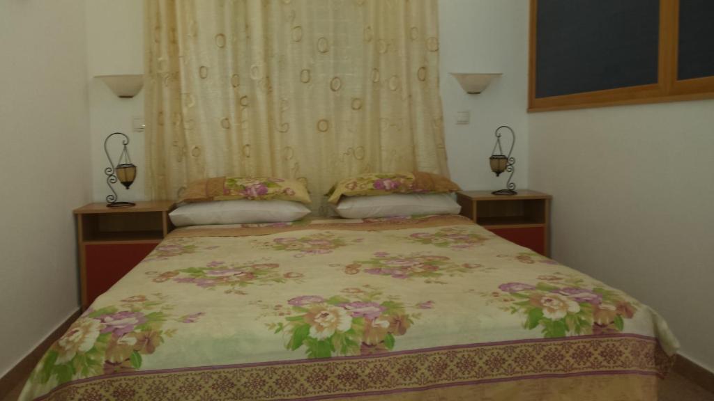 Postel nebo postele na pokoji v ubytování Galini Apartments